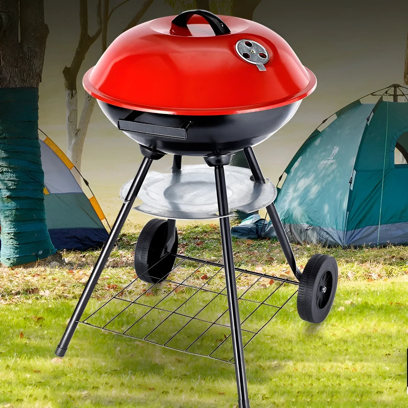 Portable iron barbecue oven with 14-inch apple stove design on a table outdoors.