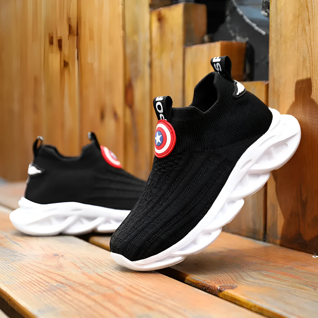 Children's black and white knitted overshoes with sleeve opening for runway or dance performances.