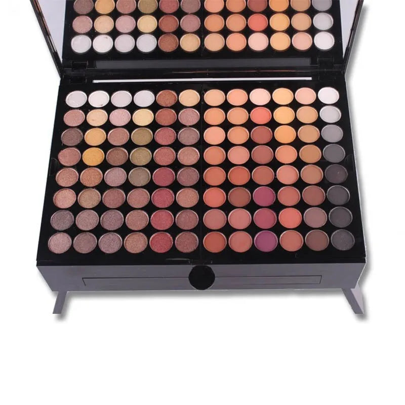 Piano-shaped makeup palette open showing 190 powder pans including eyeshadows, blushers and contour powders