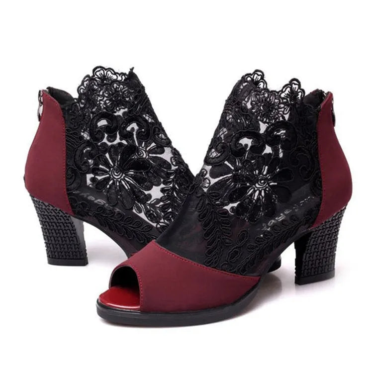 Black lace gladiator sandals for women with a square high heel, peep toe, and a zip closure.