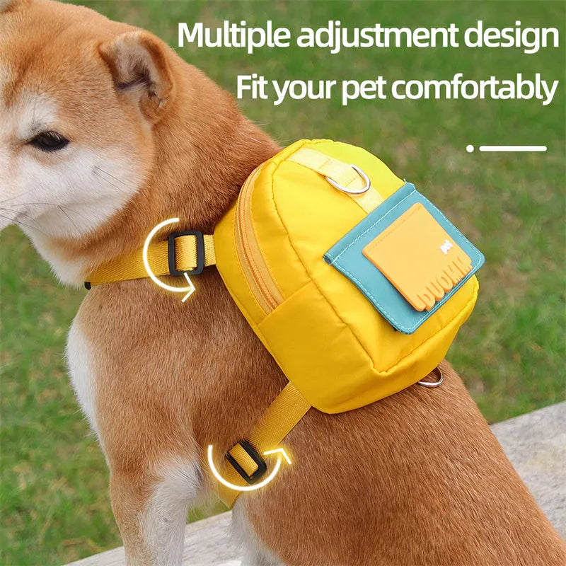 Blue adjustable dog harness backpack with breathable mesh panels and a tow rope attached.