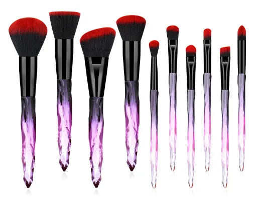 10 clear crystal handle foundation brushes with diamond shank design and black bristles.