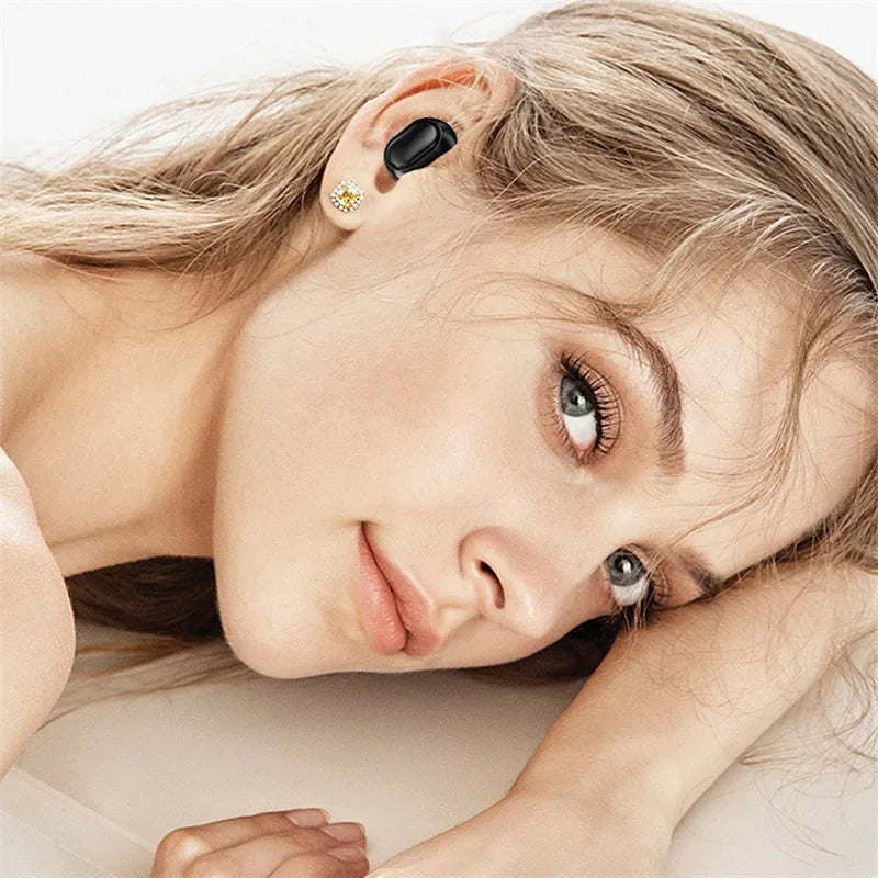 Black TWS XT01 Bluetooth earphones with charging case showing white and blue indicator lights.