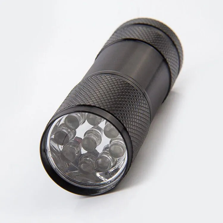Handheld portable purple light detection LED flashlight with aluminium alloy body, 3W power, 12LED option, on a plain background