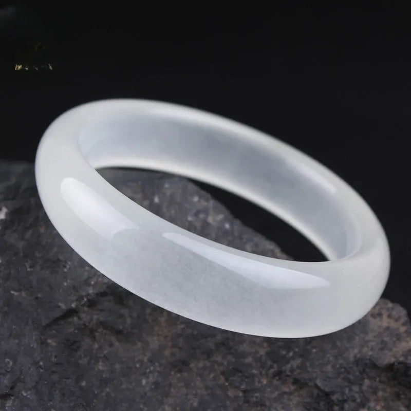 Gao Bing jade bracelet in white moonlight colour on a wrist, showing flat and round bar shape options.