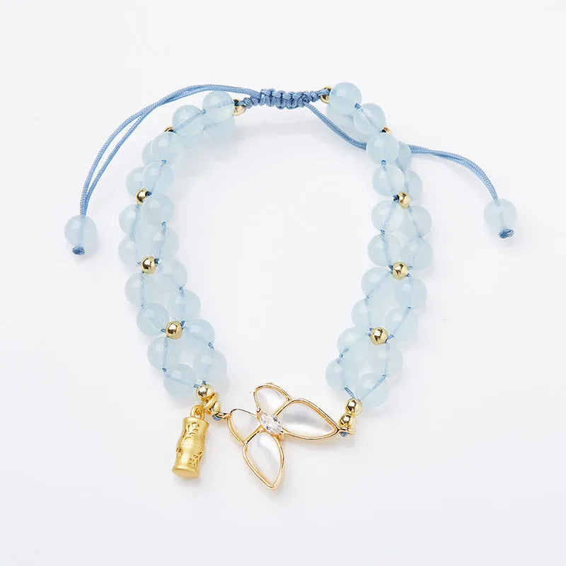Women's aquamarine butterfly woven bracelet showing 6mm width and retro design detail