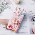 Pink and green cartoon rabbit design 3D silicone iPhone case showing textured surface and precise model fit