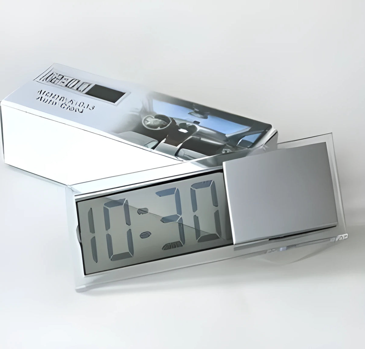 Dot matrix LCD car clock with suction cup mount placed on dashboard