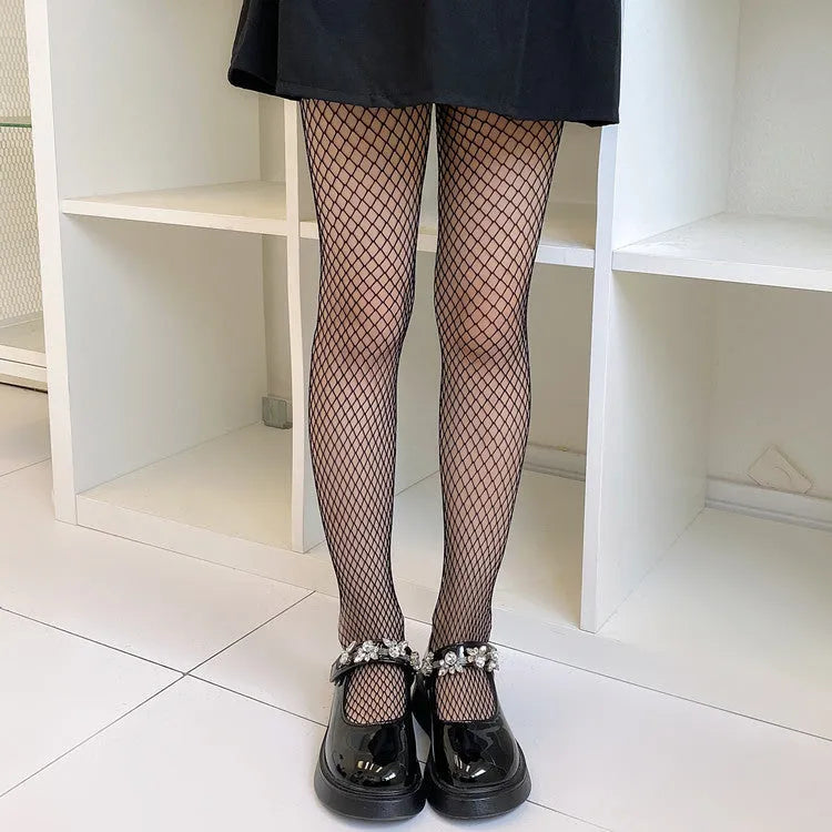 Women's black and white mesh stockings showing large, medium, and small pattern examples.