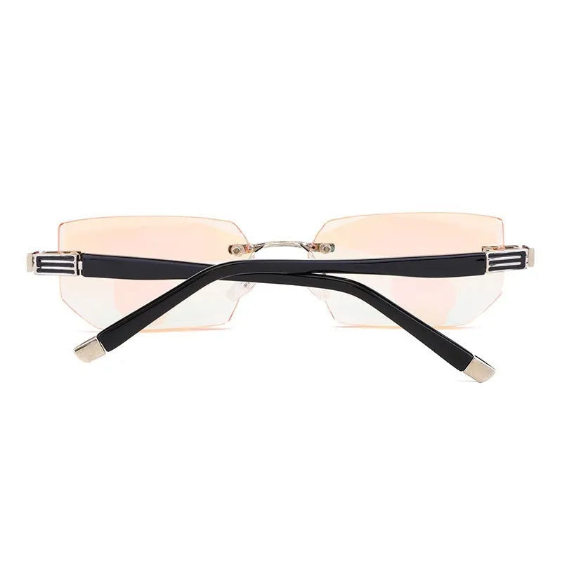 Diamond-cut metal reading glasses with tan frame and black lenses on a plain background