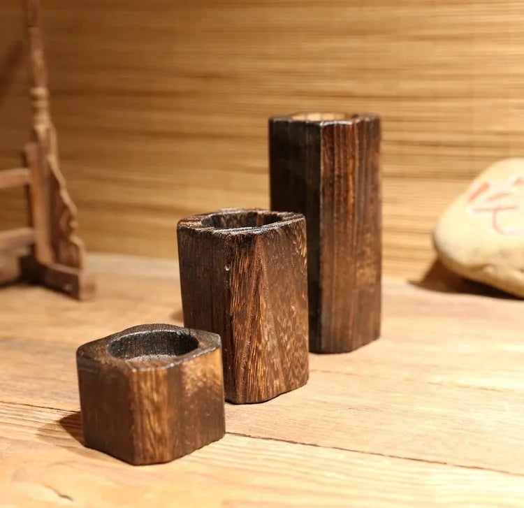 Three solid wood candle holders in natural paulownia wood charcoal-fired finish sizes small medium large
