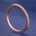 Women's crystal band ring in rose gold finish with cubic zirconia stones, US size 7