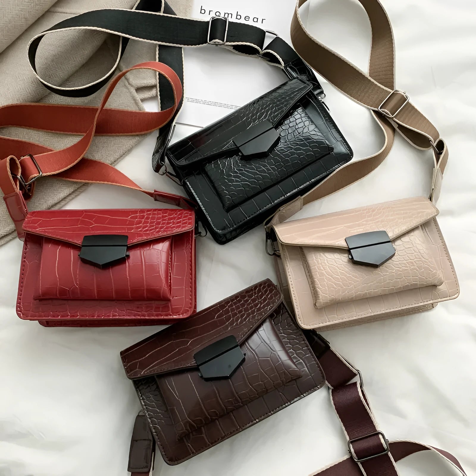 Vintage PU leather crossbody bag in black showing interior organisation for phones and wallets