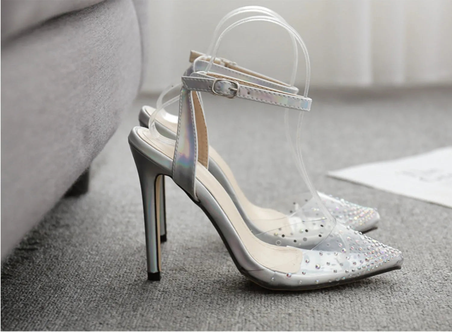 Women's pointed toe sandals with diamond pattern and stiletto heel on a white background.