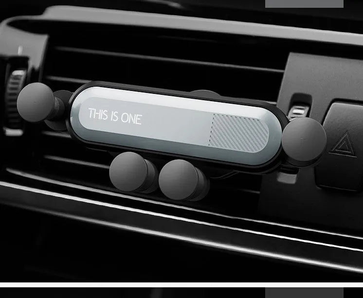 Universal car phone holder attached to vehicle air vent with smartphone securely mounted