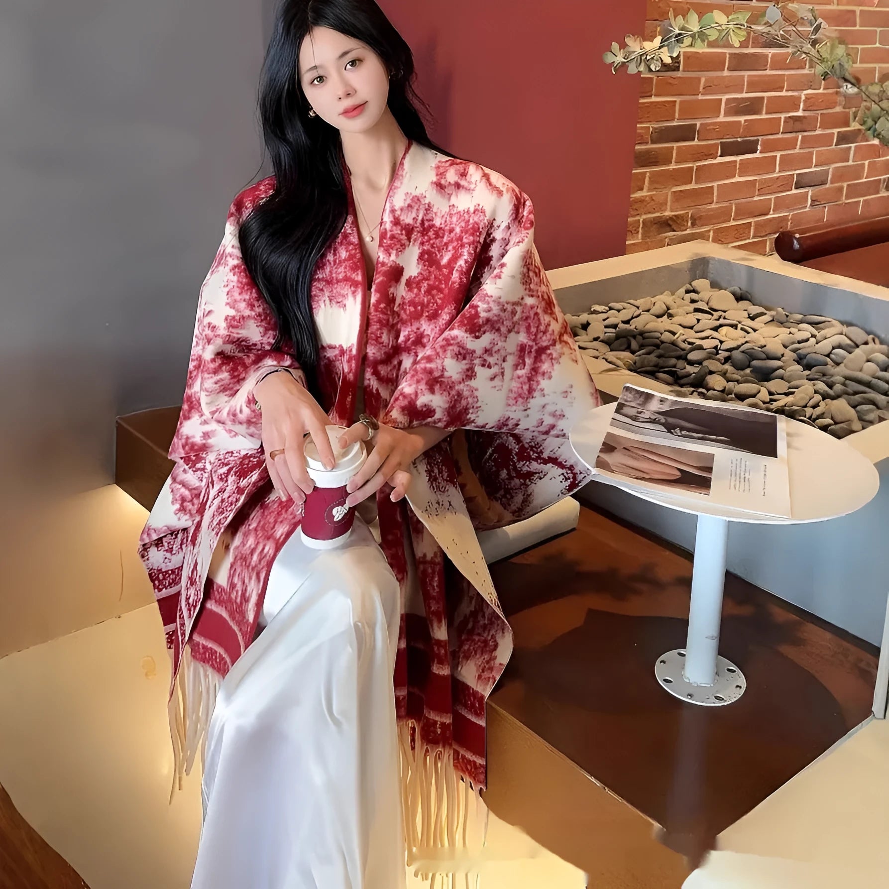 Women's polyester scarf cape with tassel trim in a free size shawl style.