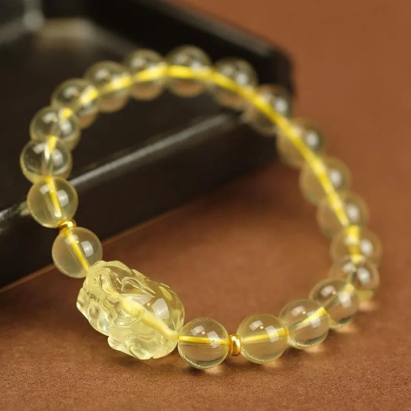 Yellow leather bracelet with an artificial crystal Citrine Pi Xiu charm in national Chinese style.