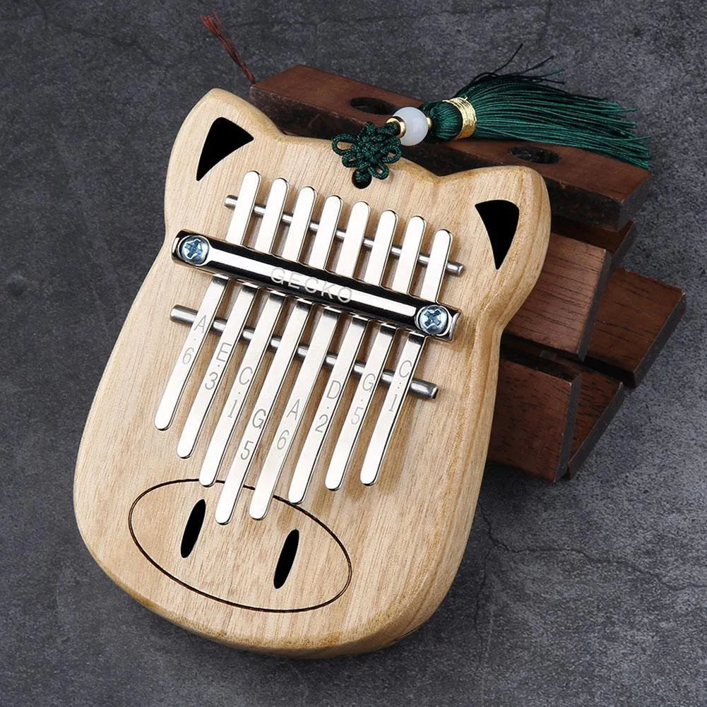 Camphorwood Mini K8 keyboard percussion instrument with five C sounds, 11.5 x 9 x 3 cm, natural wood colour.