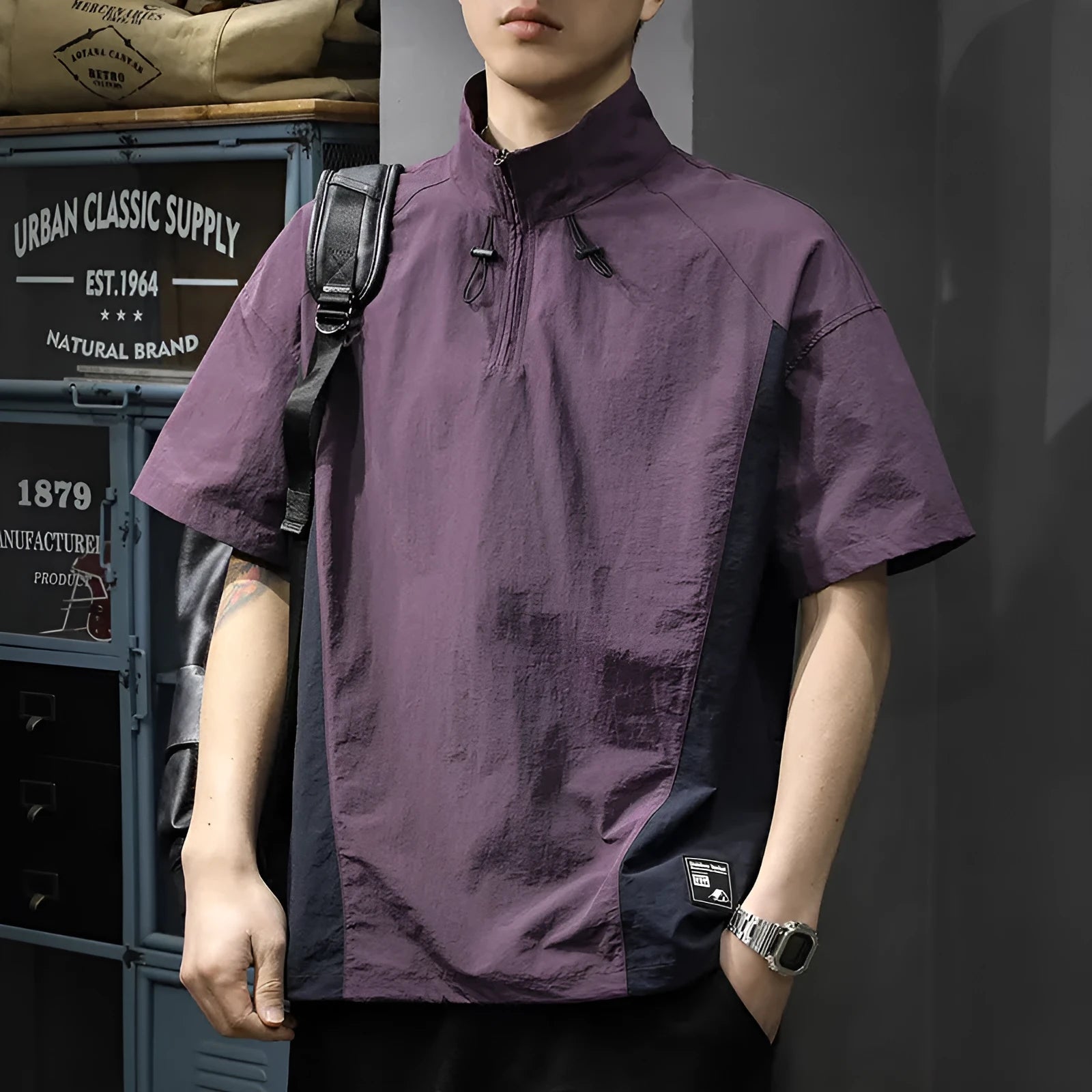 Brown men's half-zip stand collar short-sleeved shirt on a hanger