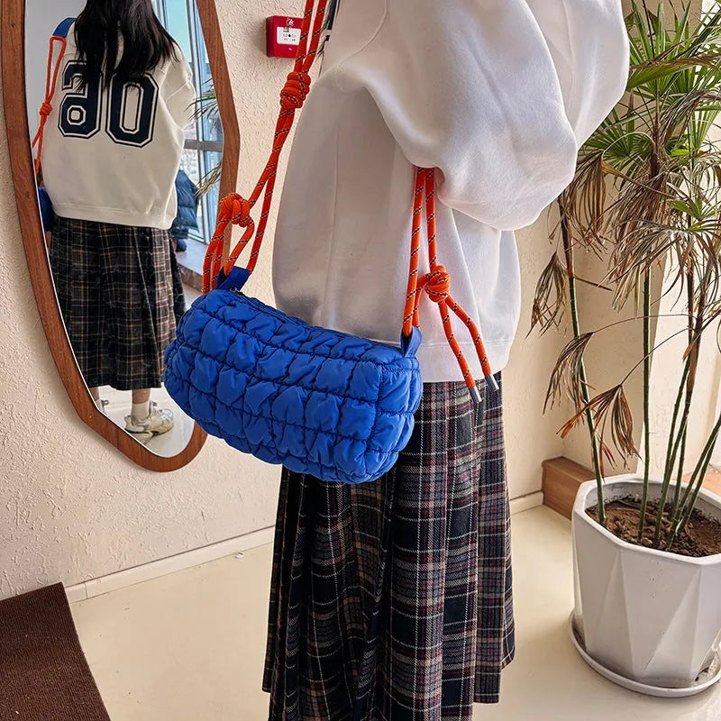 Women's lightweight nylon messenger bag in pillow shape with diamond quilted pattern