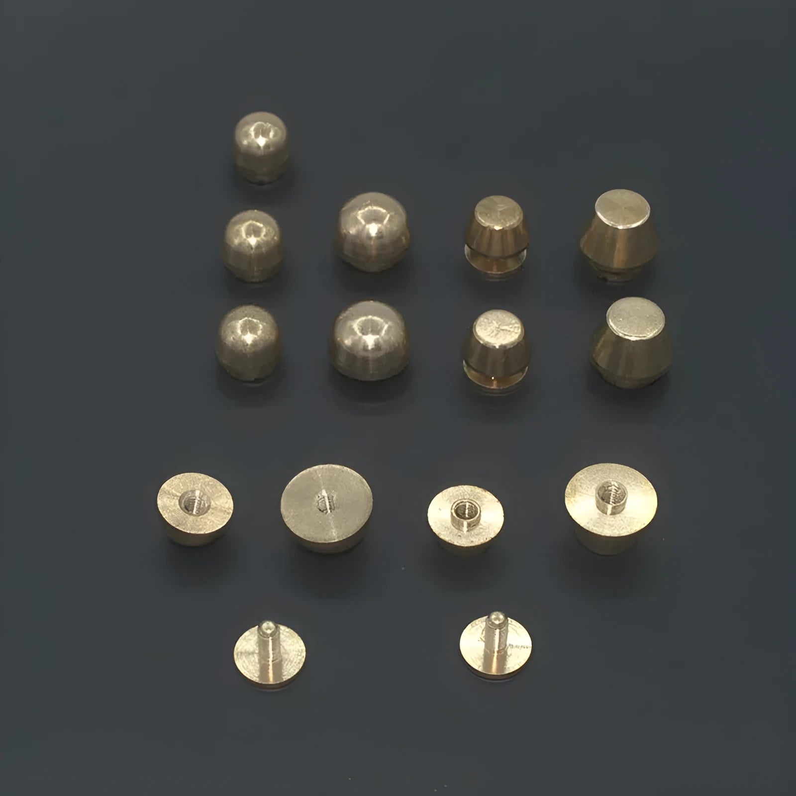 Brass decorative buckle foot nails in round and bucket styles measuring 10x6mm and 12x7mm