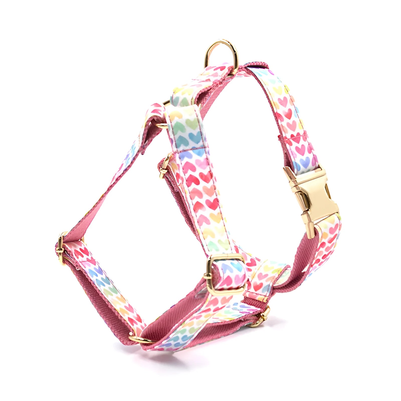 Pink colourful dog harness with heart-shaped stones and gold buckle fastenings on chest and back support design