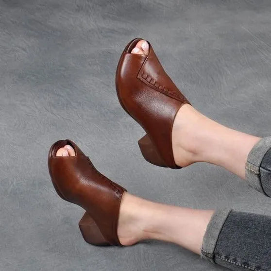 Women's black square heel peep-toe slippers with a fish mouth vamp design on a white background.