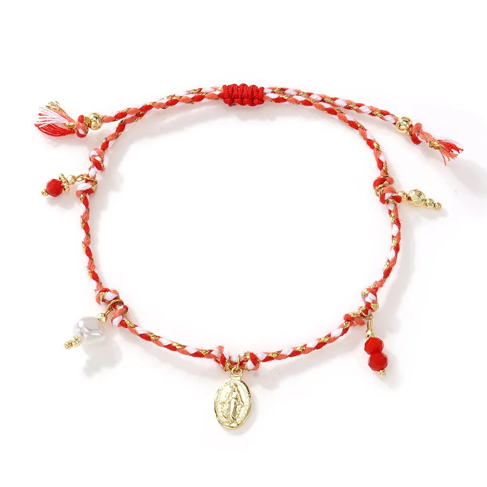 A colourful hand-woven braided rope bracelet in an ethnic strap style for women.