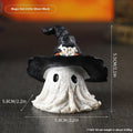 A detailed resin wizard hat ornament in either black or purple, for Halloween and holiday decoration.
