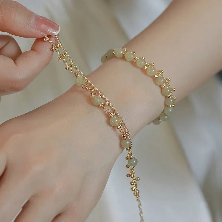 Natural Hetian jade beaded bracelet in classic princess running style for women.