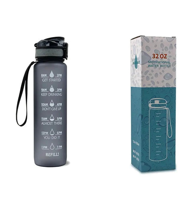 Blue and red gradient 1 litre Tritan sports water bottle with time markers and a black flip-top lid.