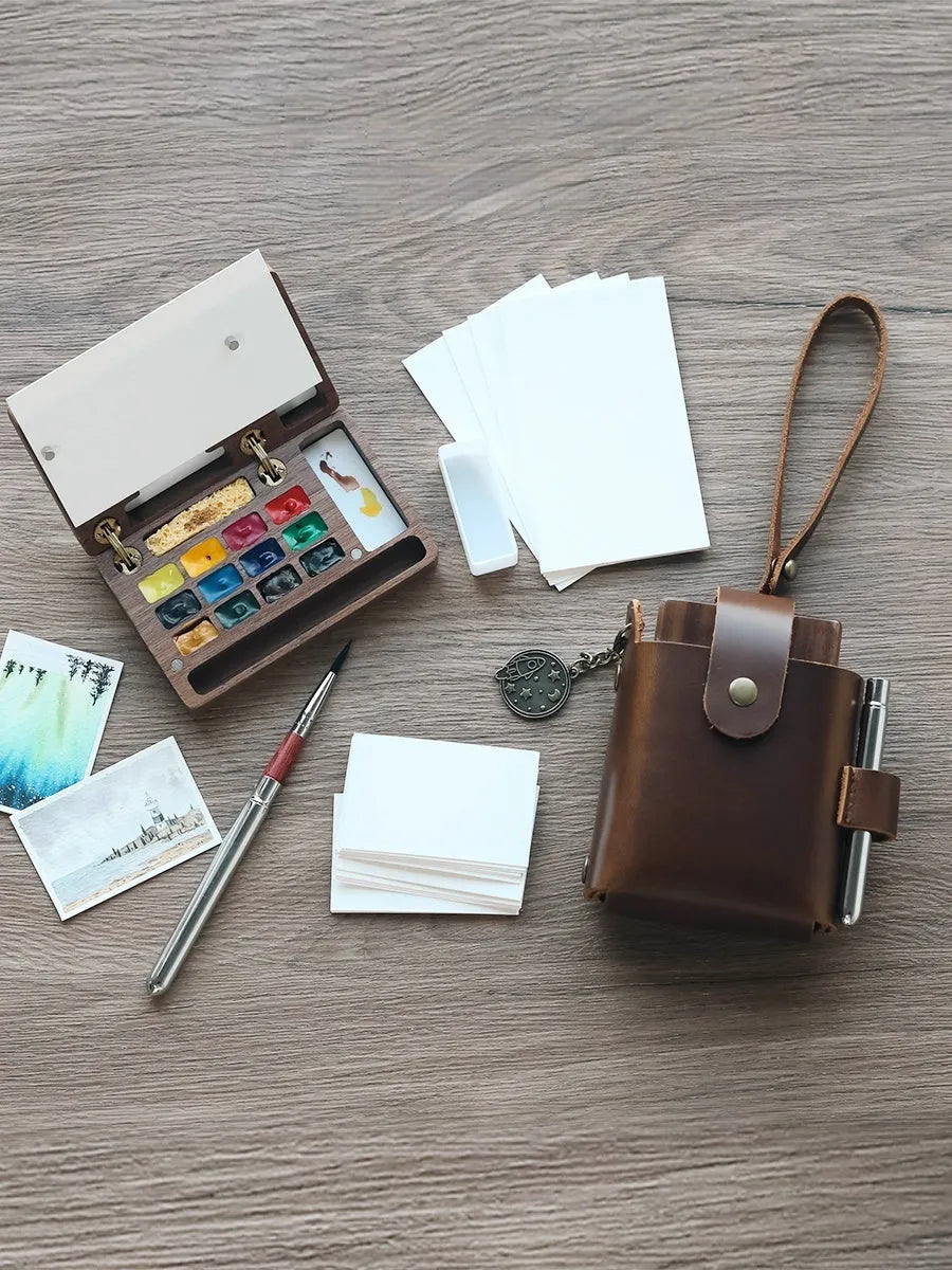 Mini walnut wood watercolour paint box for artist pigment sets.