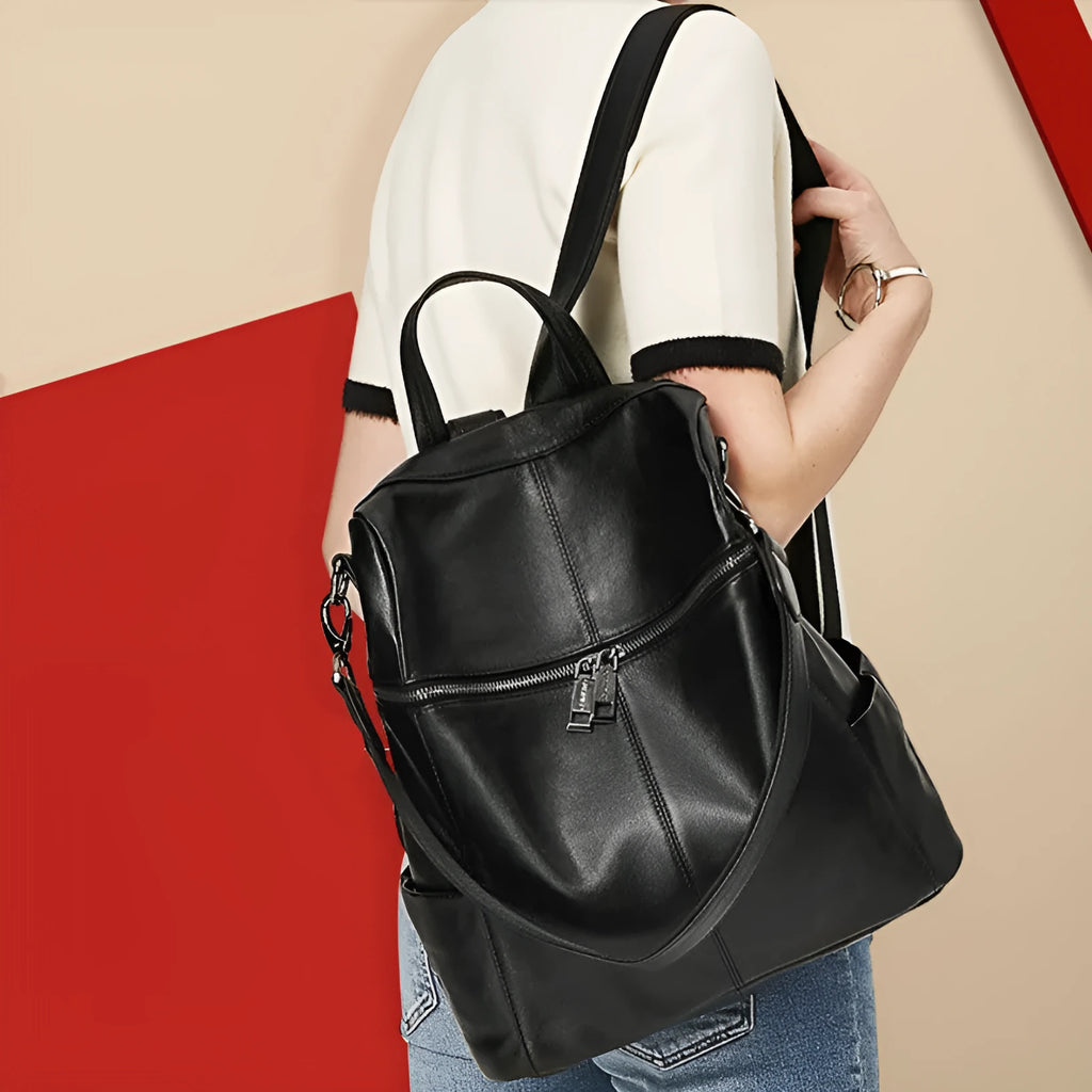 Women's genuine leather retro backpack showing internal organisation compartments and sewing thread detailing