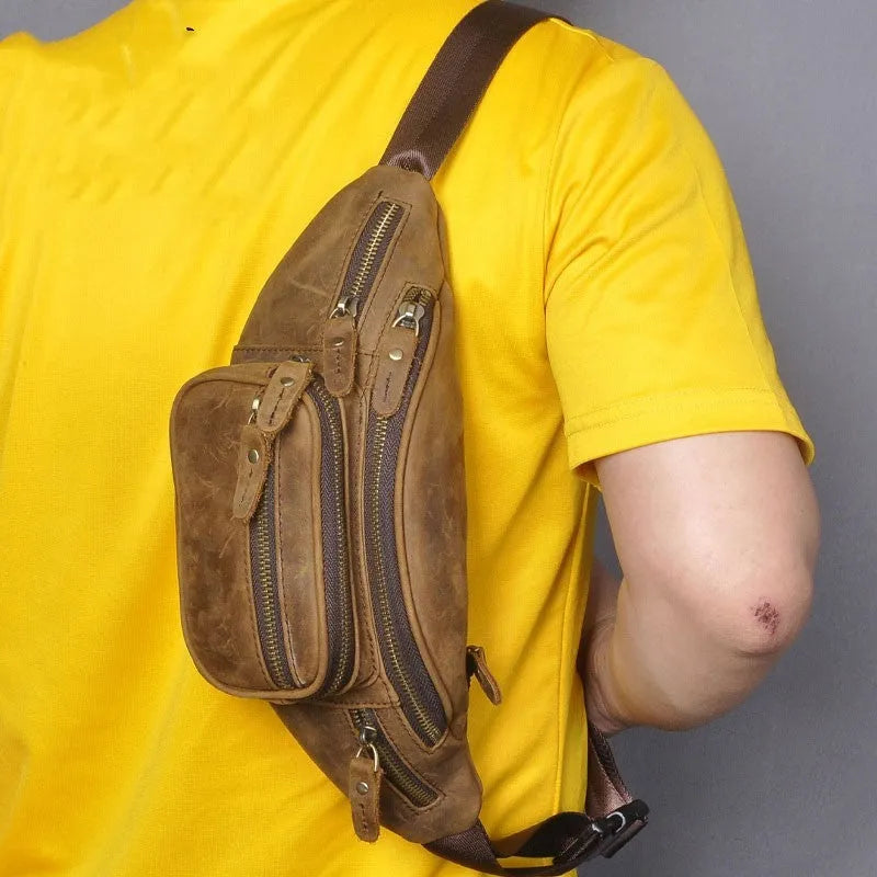 Brown leather shoulder messenger bag with a single strap and top flap closure.