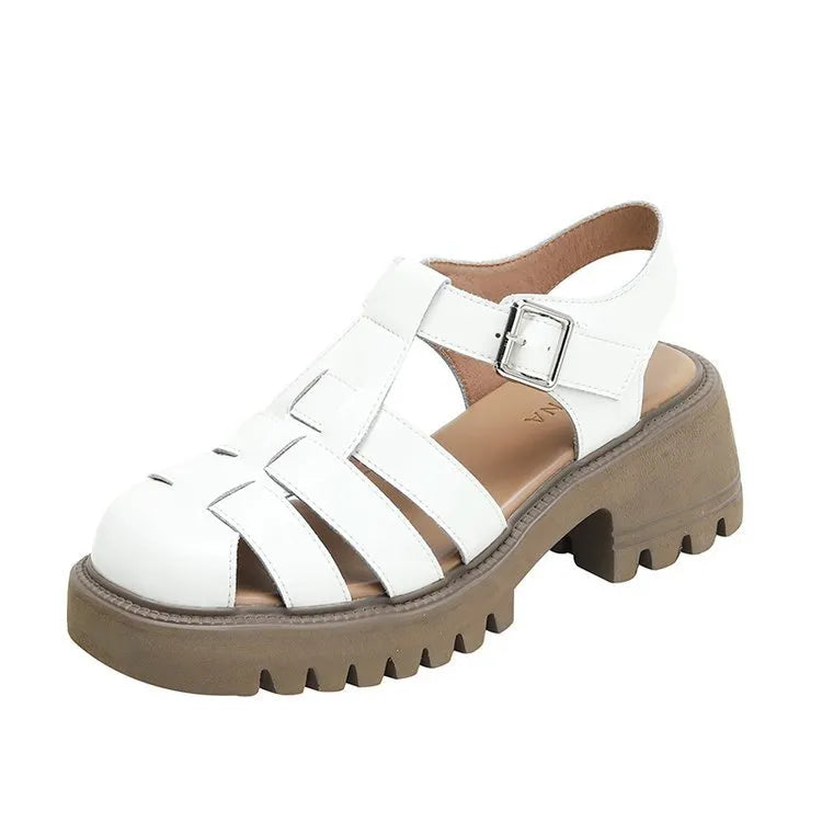 Women's black retro platform sandals with closed toe, hollow sides, chunky heel, and a buckle fastening.