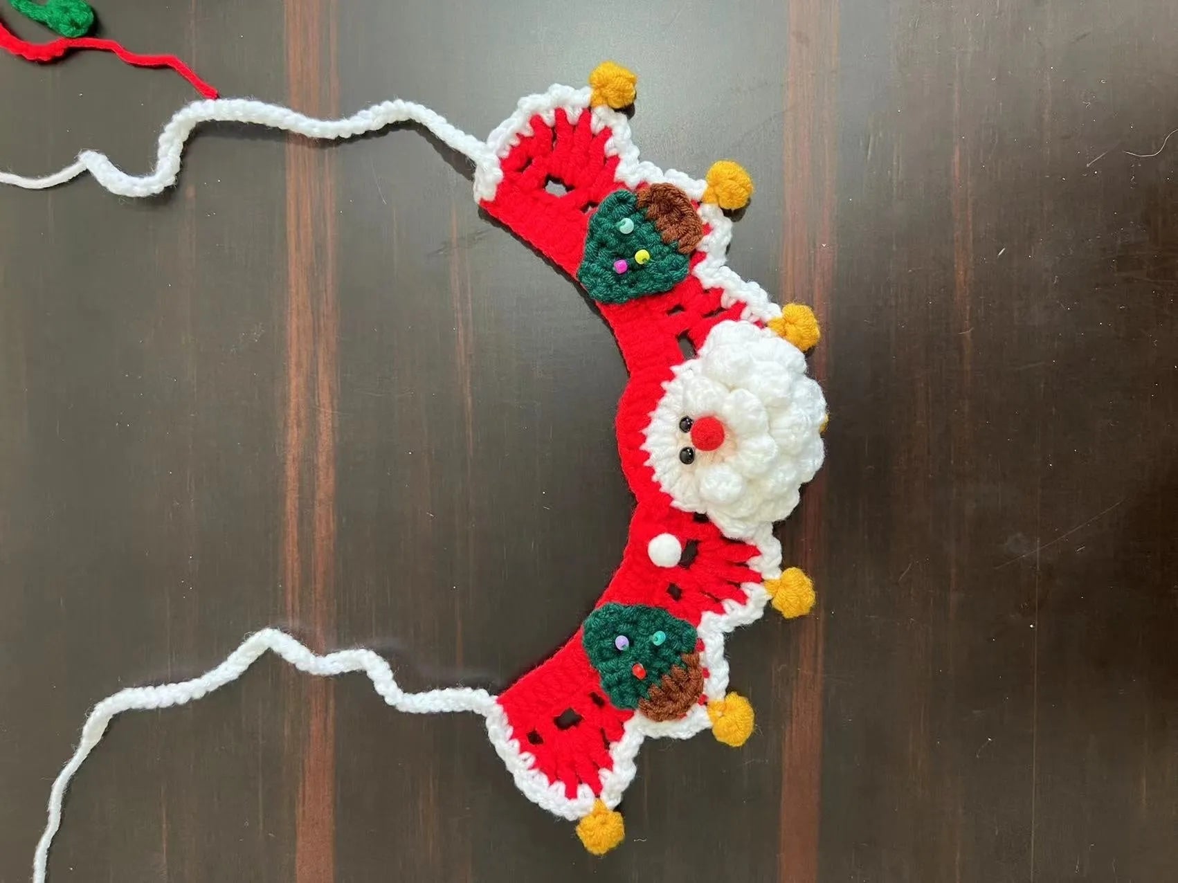 Christmas knitted wool pet scarf with festive patterns attached to dog collar