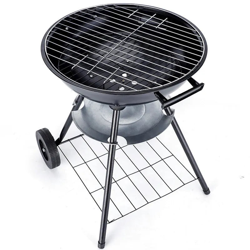Portable iron barbecue oven with 14-inch apple stove design on a table outdoors.
