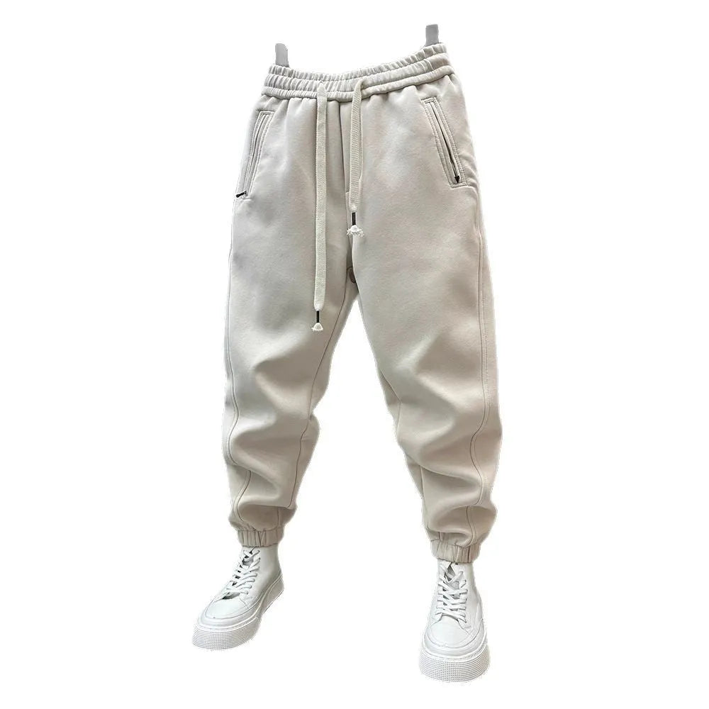 Summer men's solid colour polyester track sweatpants with zippered pockets and ankle ties, black, side view