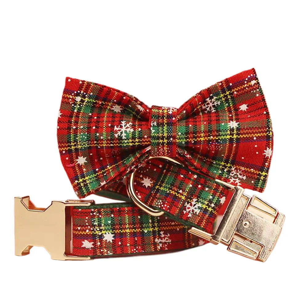 Green snowflake Christmas pet collar set with matching dog leash, bow decoration and vest in four-piece bundle