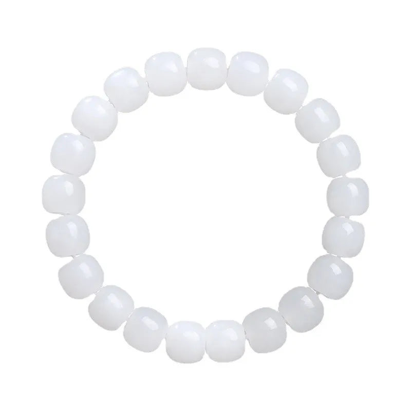 White Hetian jade barrel bead bracelet for men and women, shown in a casual style.