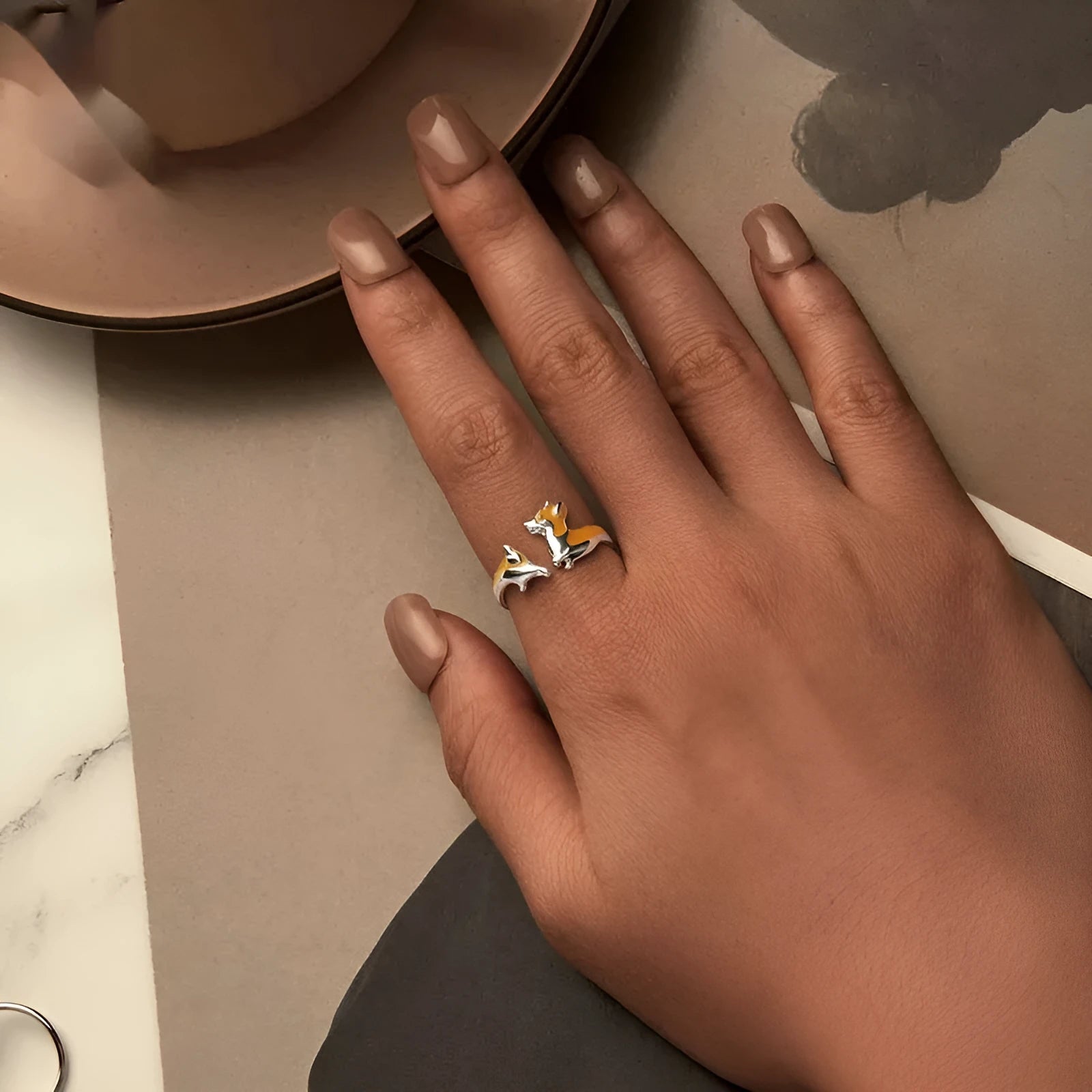 Silver-coloured adjustable ring featuring a raised cartoon corgi dog design, model SCR1014-E.