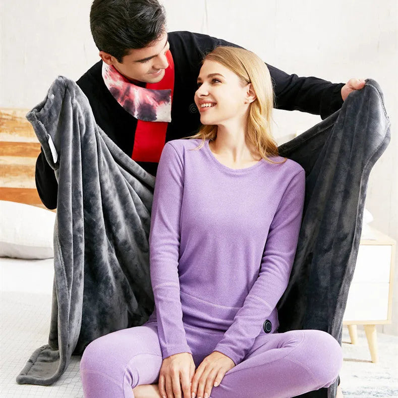 Dark grey USB electric heated plush blanket showing plug and control button.