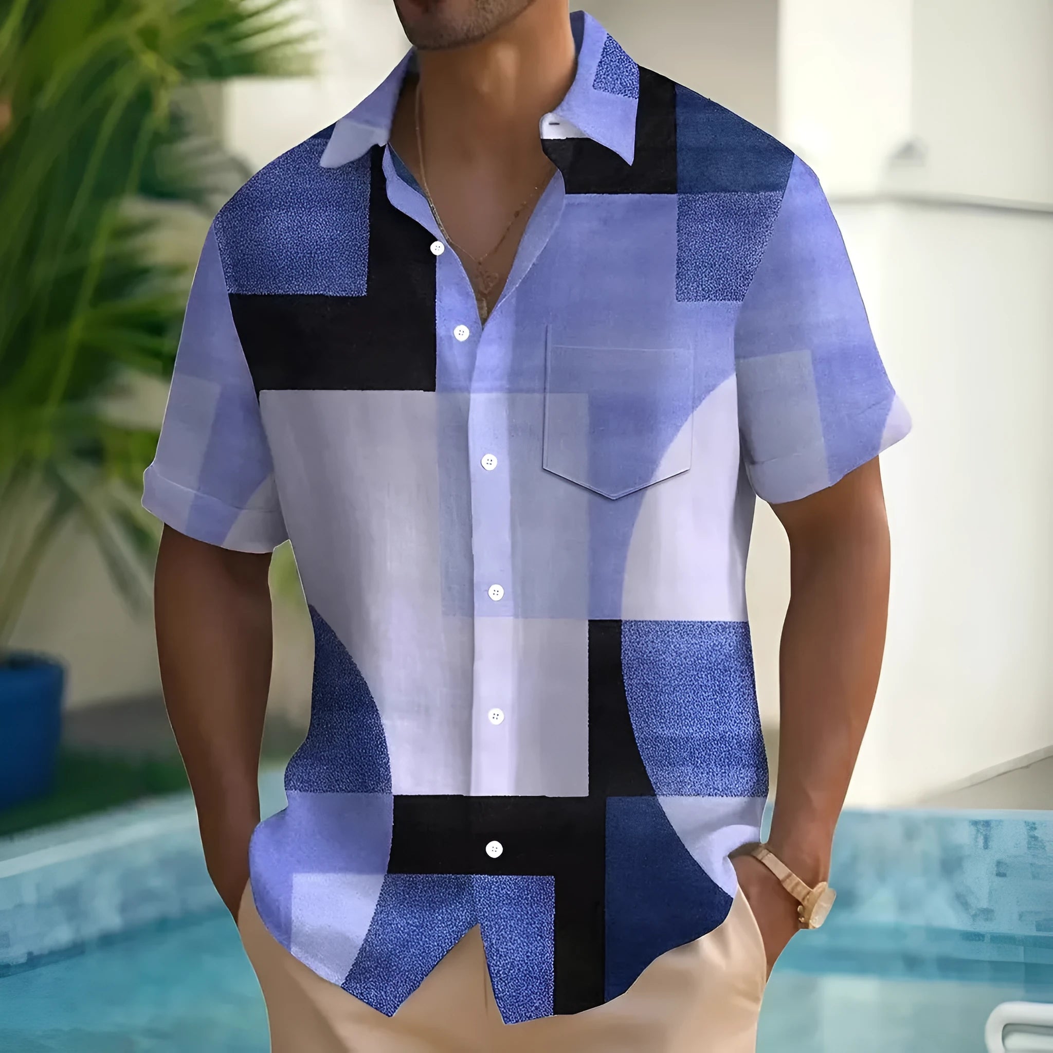 Man wearing a loose-fit geometric pattern cardigan shirt in contrasting colours, short sleeves.