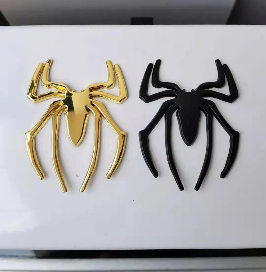Three-dimensional metal spider car sticker in zinc alloy on a vehicle bumper.