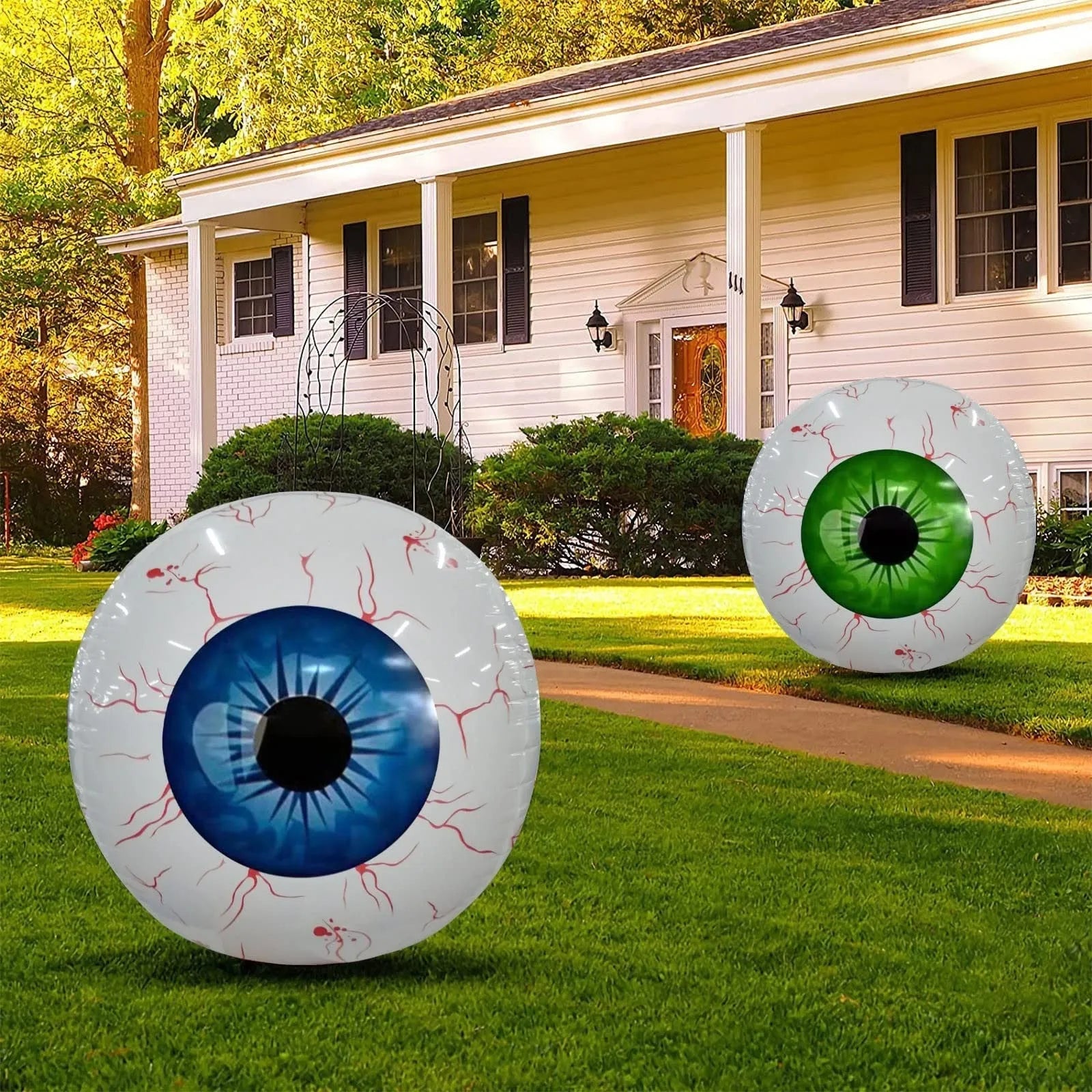 Large green Halloween eyeball balloon with bloodshot design, shown inflated.