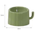 Dark green cat bowl with cactus design, showing wide mouth, heavy base, and anti-slip ring