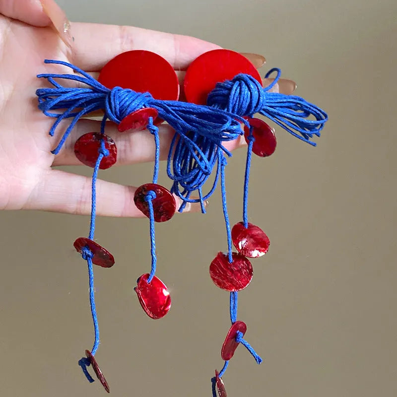 Geometric women's earrings with blue resin flowers on cloth material in silver needle colour