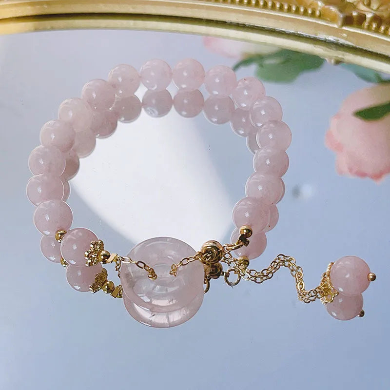 Pink crystal women's bracelet with peace buckle design and adjustable safety buckle closure