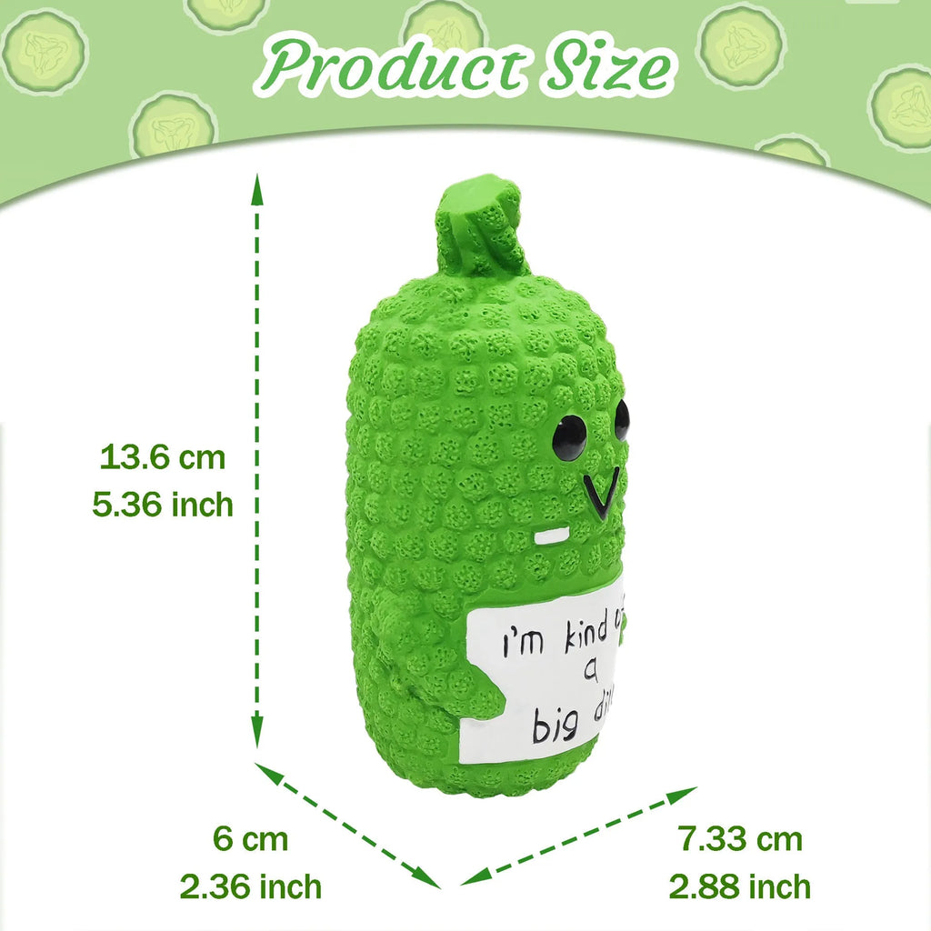 Green pickle-shaped latex squeaky dog toy with textured nubs on a white background.