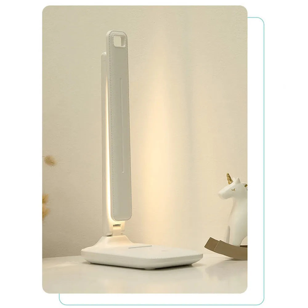 White touch dimming colour-changing bedside lamp with USB charging cable.